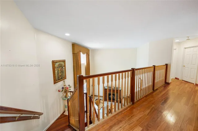 a spacious bathroom with a double vanity sink a mirror and a bathtub