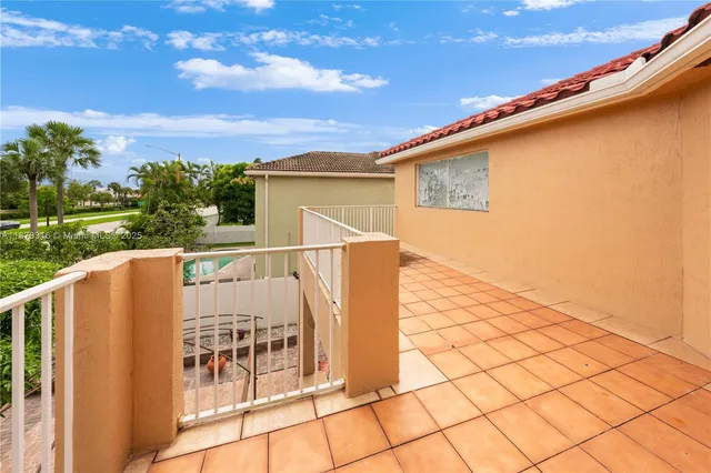 a view of a backyard with sitting area