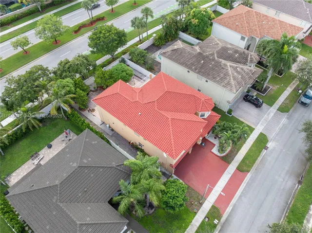 an aerial view of a house with a garden