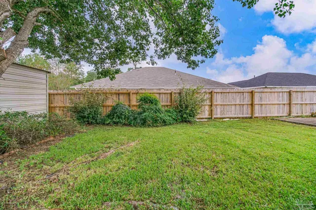 a view of a house with a garden