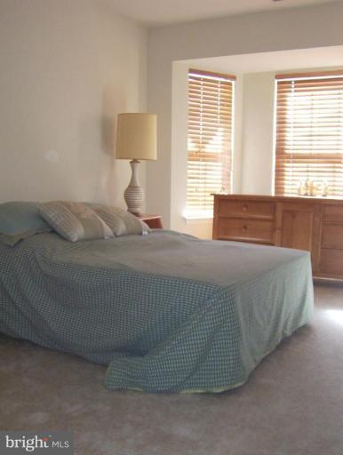4012 Cutty Sark Road Middle River, MD 21220 - Photo 14 of 16 a bedroom with a bed and a large window
