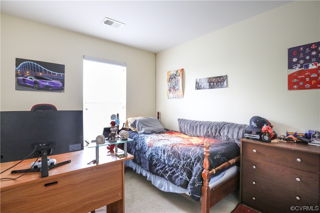 327 Rolkin Road Charlottesville, VA 22911 - Photo 12 of 18 a bed room with a bed and a couch