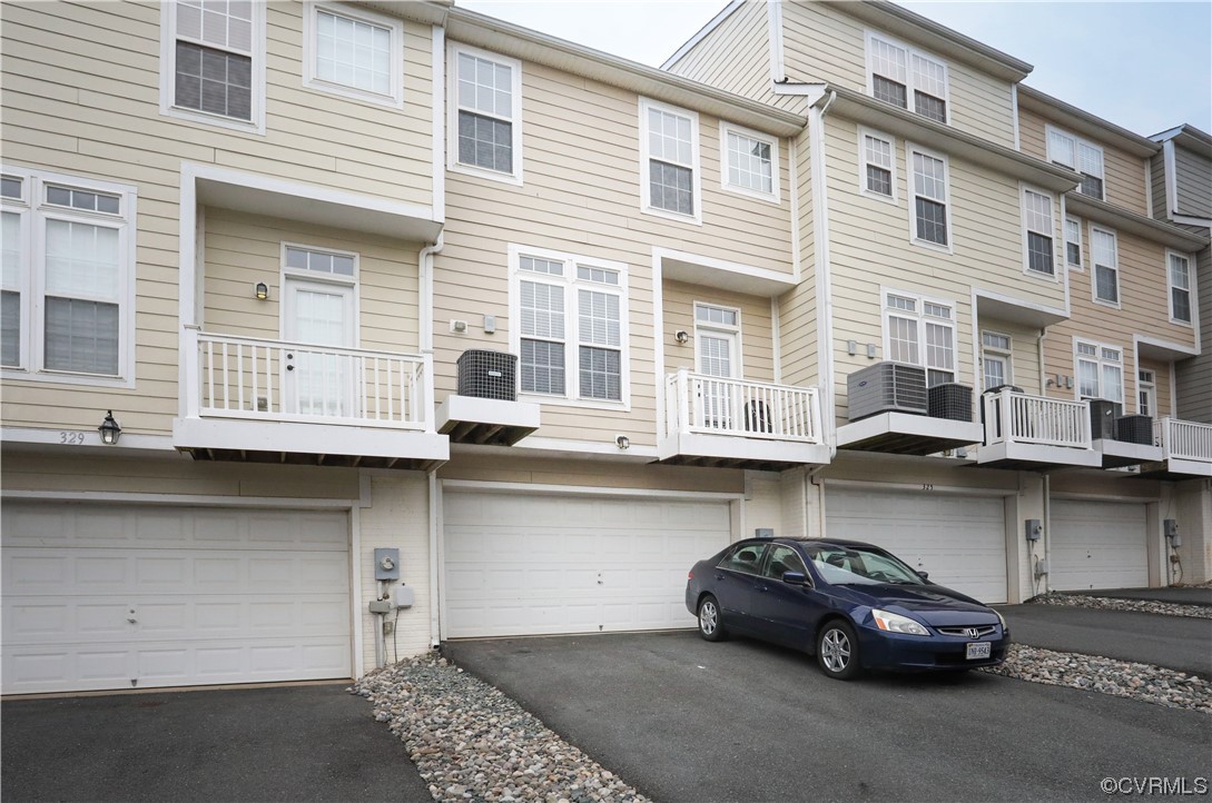 327 Rolkin Road Charlottesville, VA 22911 - Photo 16 of 18 a front view of a building with cars parked
