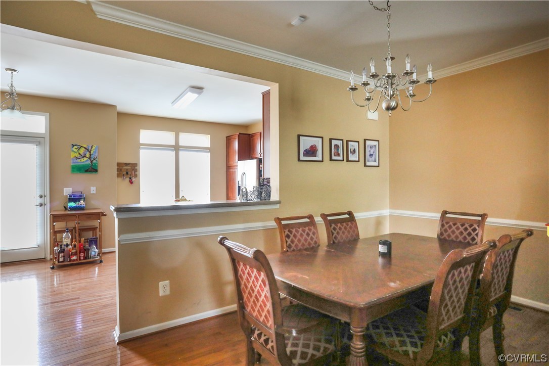 327 Rolkin Road Charlottesville, VA 22911 - Photo 5 of 18 a view of a dining room with furniture wooden floor and chandelier