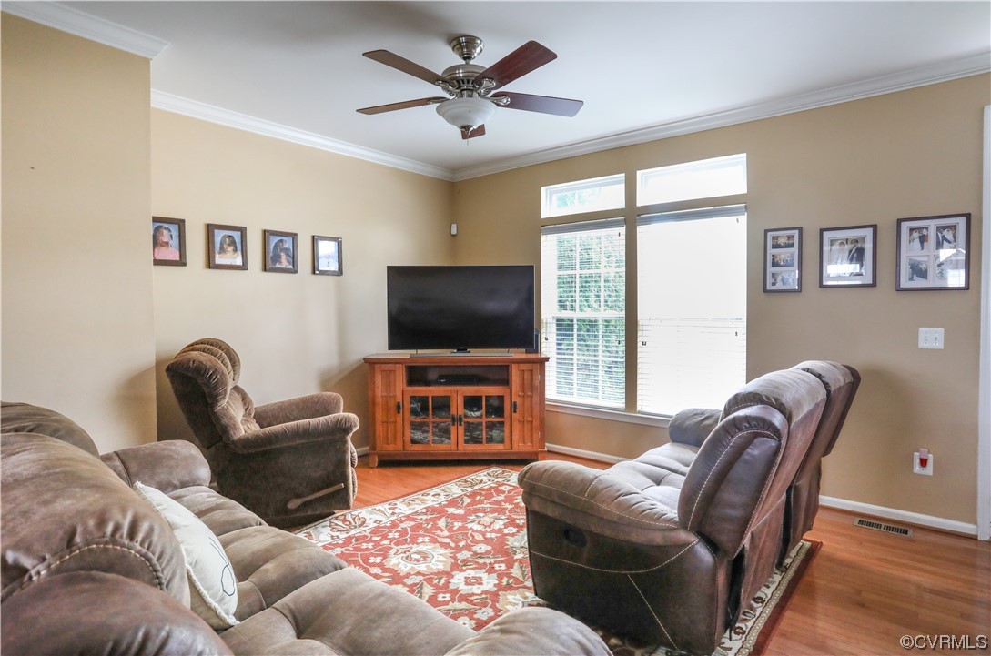 327 Rolkin Road Charlottesville, VA 22911 - Photo 6 of 18 a living room with furniture a flat screen tv and a large window