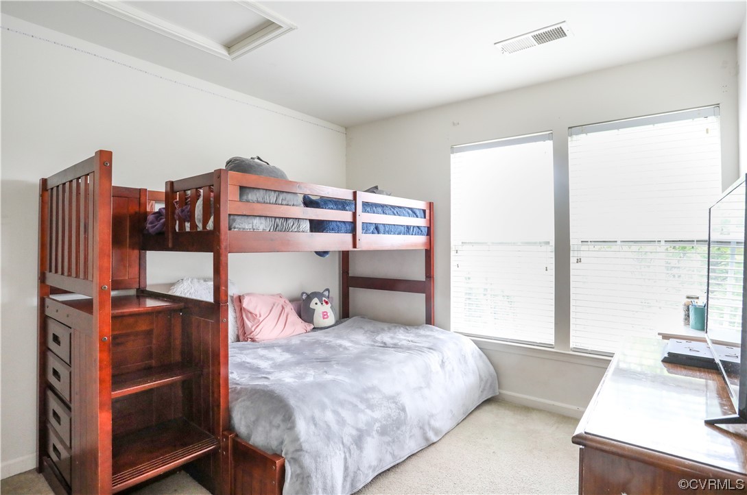 327 Rolkin Road Charlottesville, VA 22911 - Photo 10 of 18 a bedroom with a bed and a large window