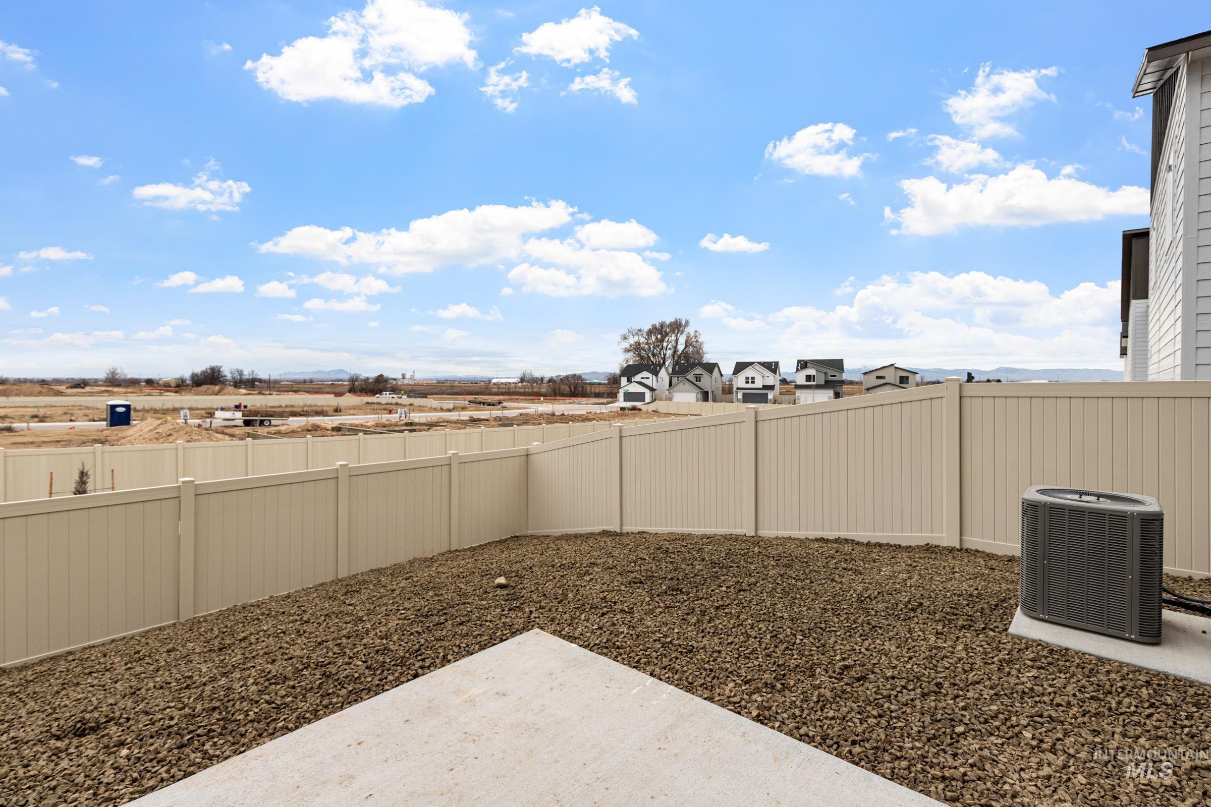 10818 Rutland Street Caldwell, ID 83605 - Photo 21 of 22 Fenced backyard featuring a patio and a residential view