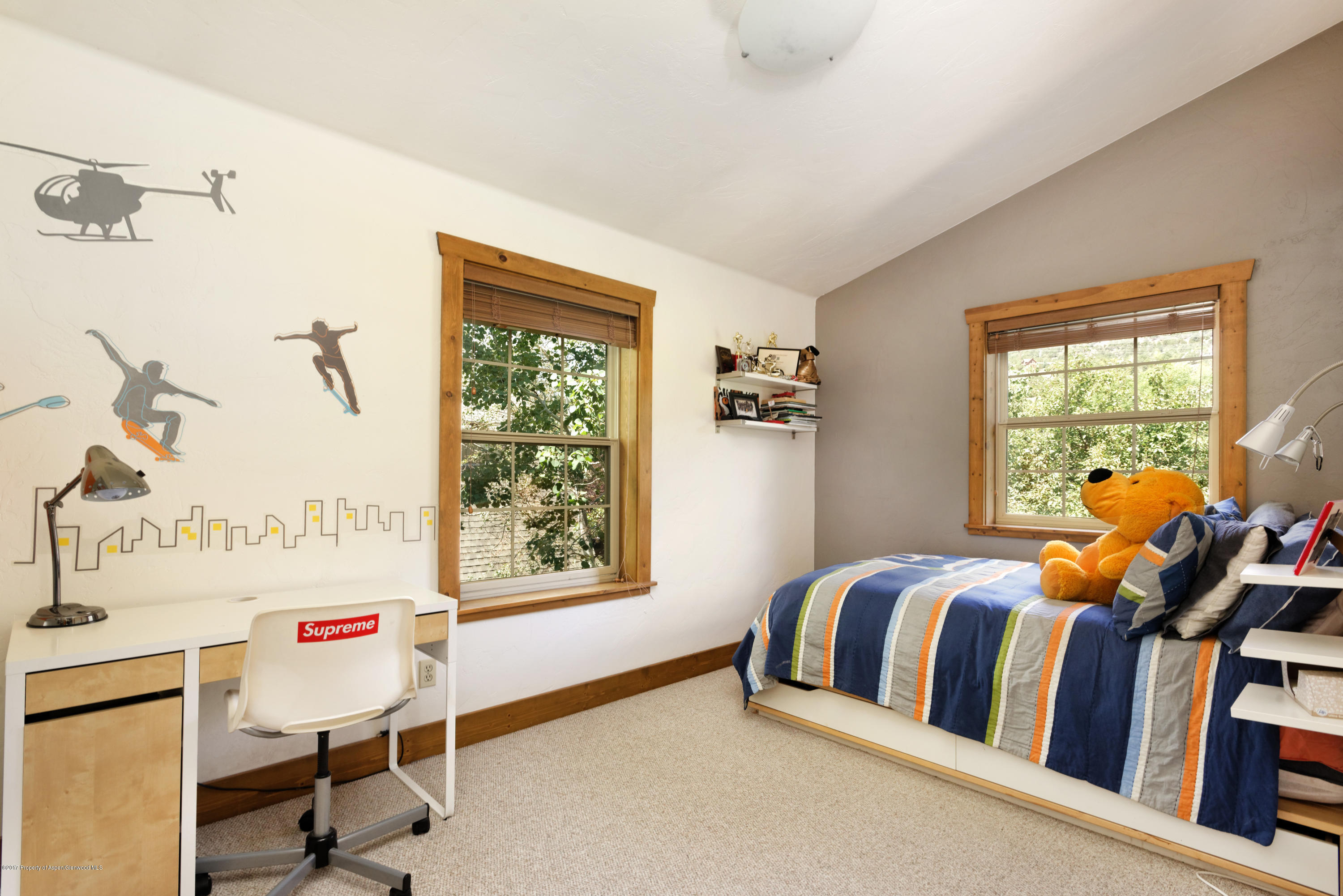 185 Riverside Drive Basalt, CO 81621 - Photo 12 of 34 a bedroom with a bed and a window