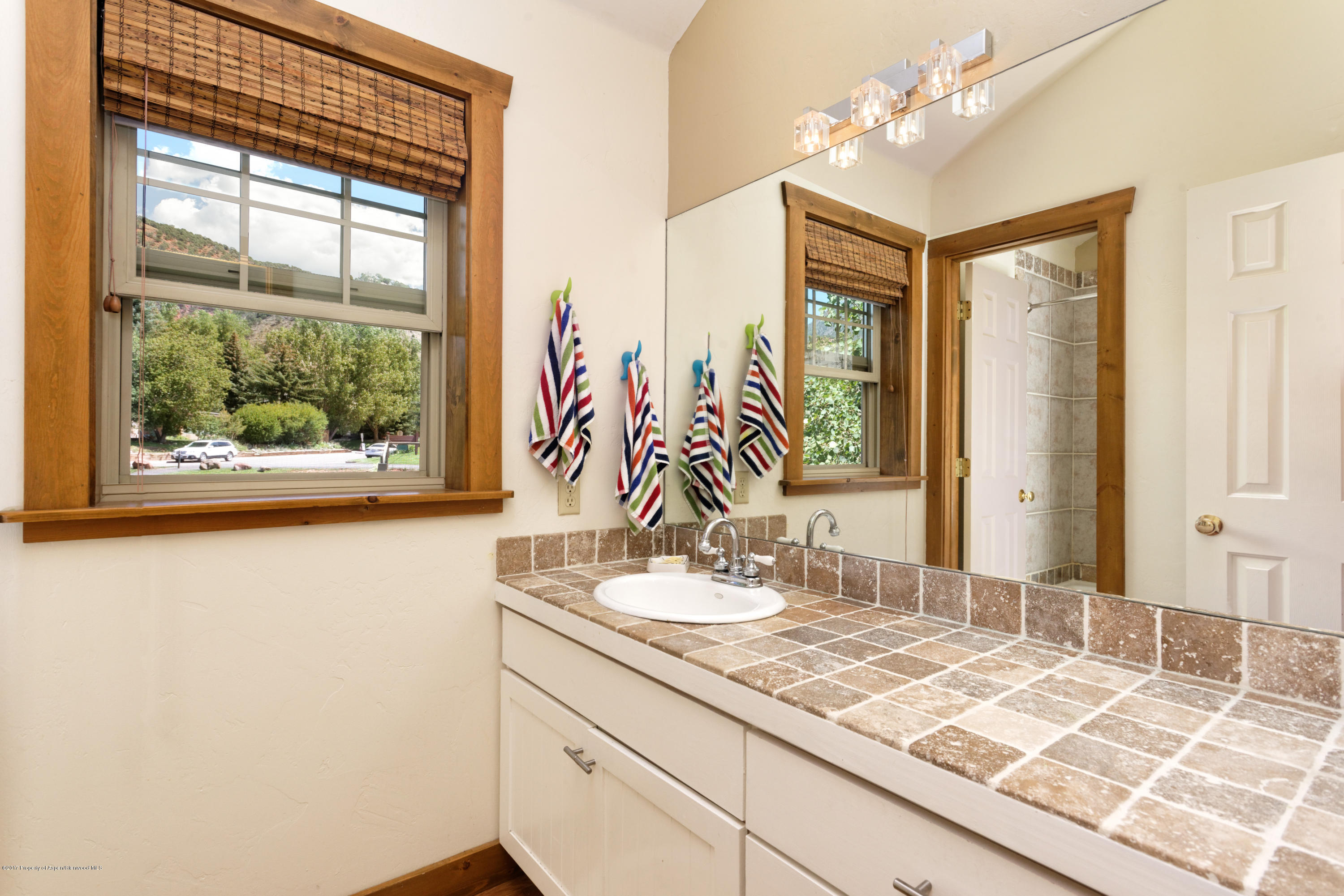 185 Riverside Drive Basalt, CO 81621 - Photo 13 of 34 a bathroom with a sink and a mirror