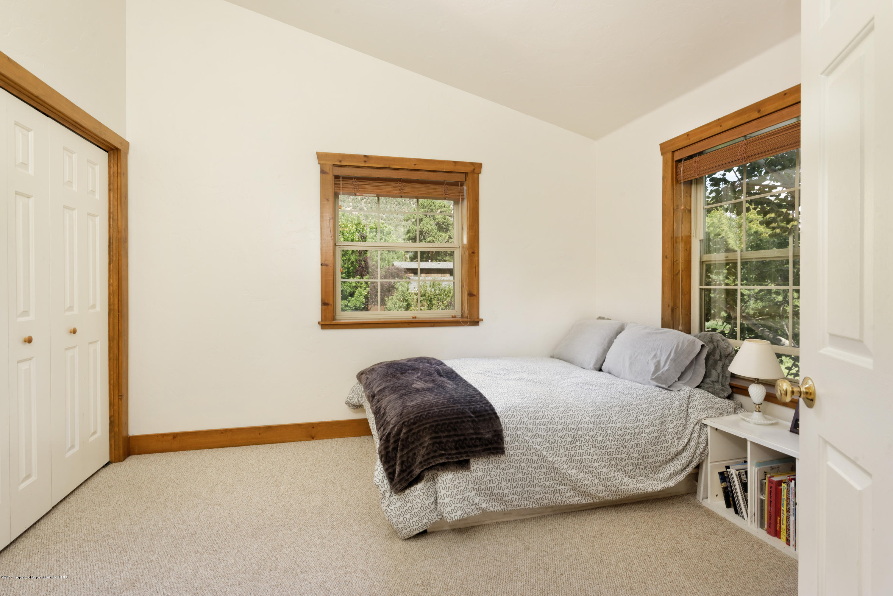185 Riverside Drive Basalt, CO 81621 - Photo 14 of 34 a bedroom with a bed and a window