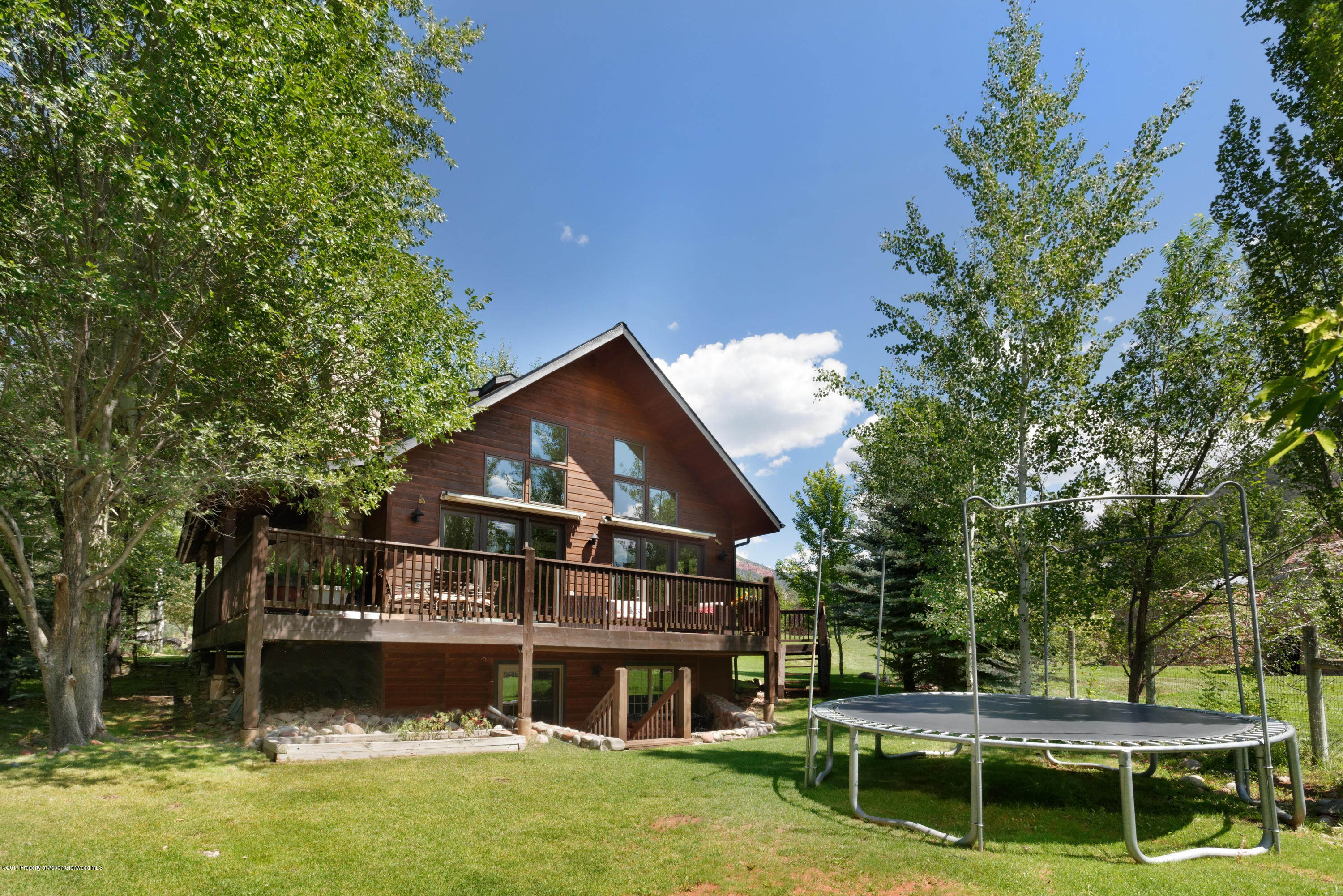 185 Riverside Drive Basalt, CO 81621 - Photo 24 of 34 a front view of a house with a yard