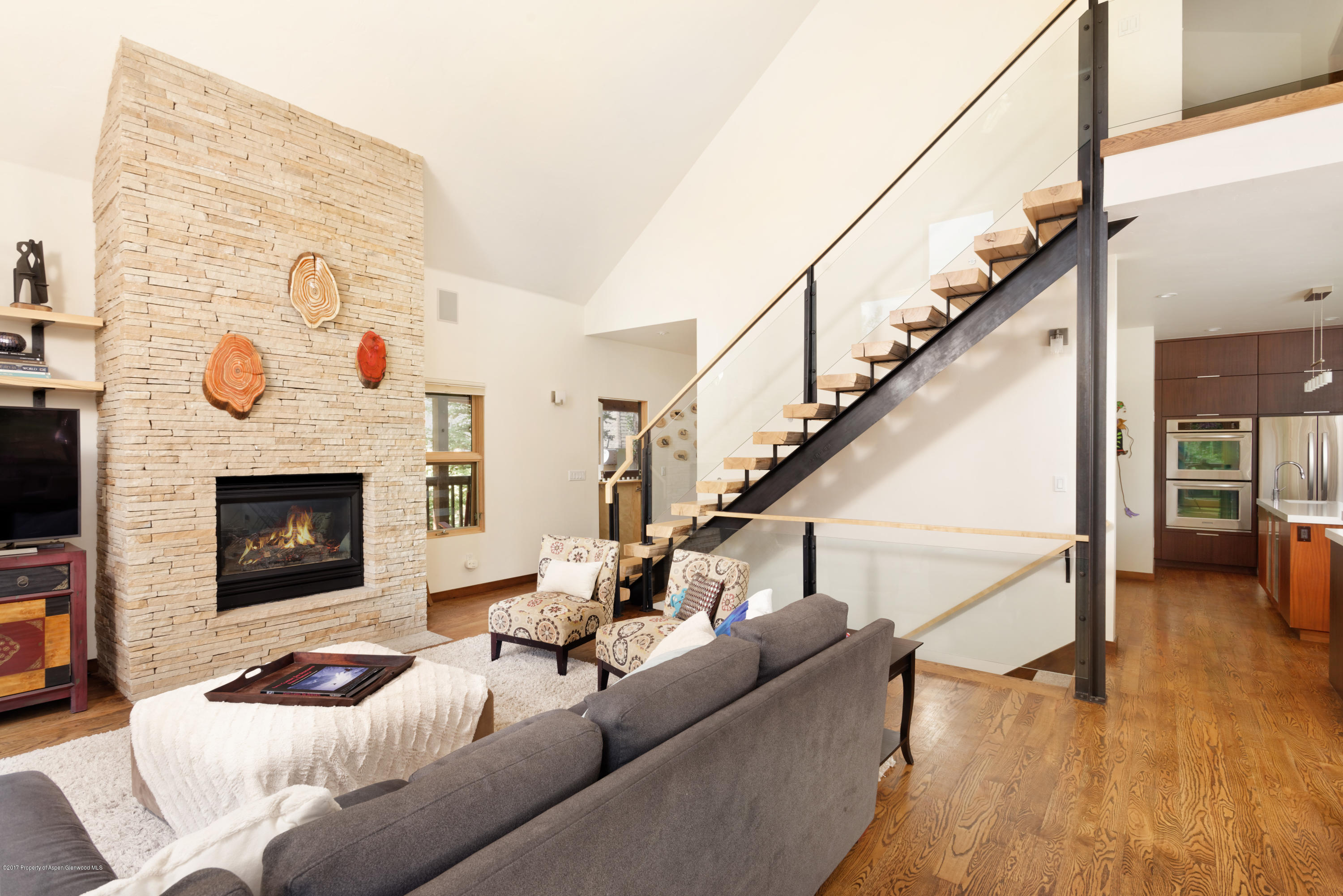 185 Riverside Drive Basalt, CO 81621 - Photo 3 of 34 a living room with furniture and a fireplace