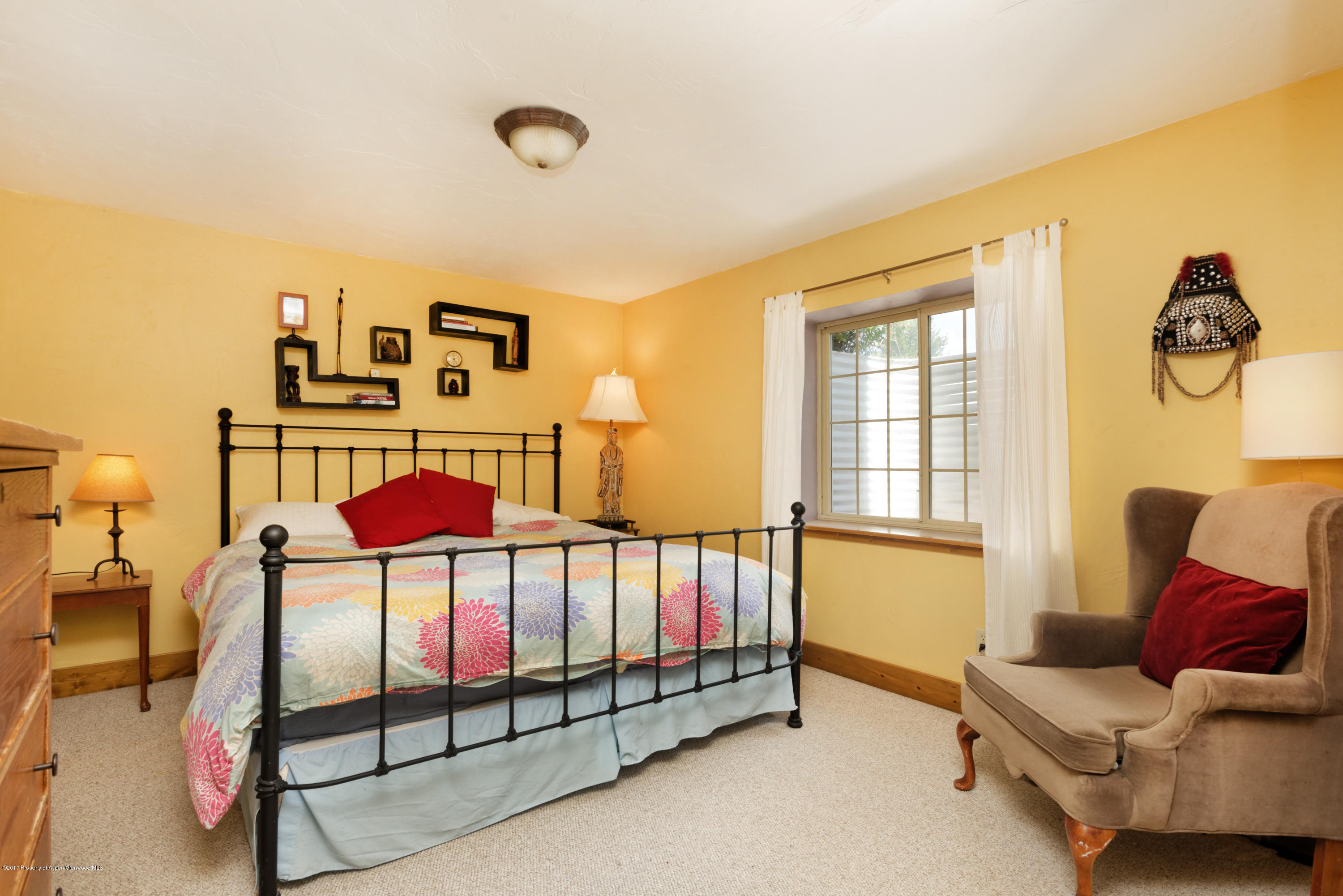 185 Riverside Drive Basalt, CO 81621 - Photo 31 of 34 a bedroom with furniture and a window