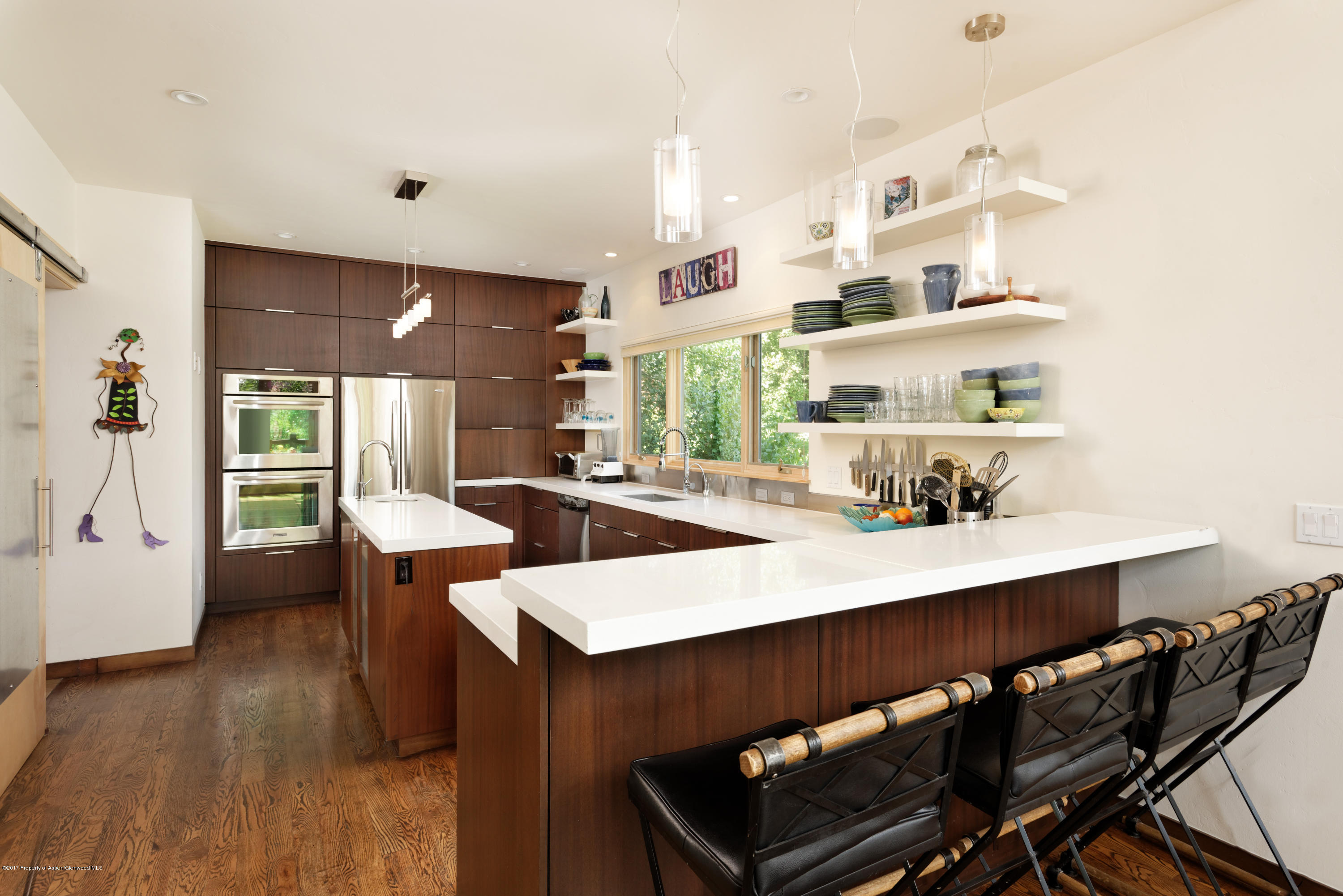 185 Riverside Drive Basalt, CO 81621 - Photo 7 of 34 a view of a dining room with furniture and wooden floor