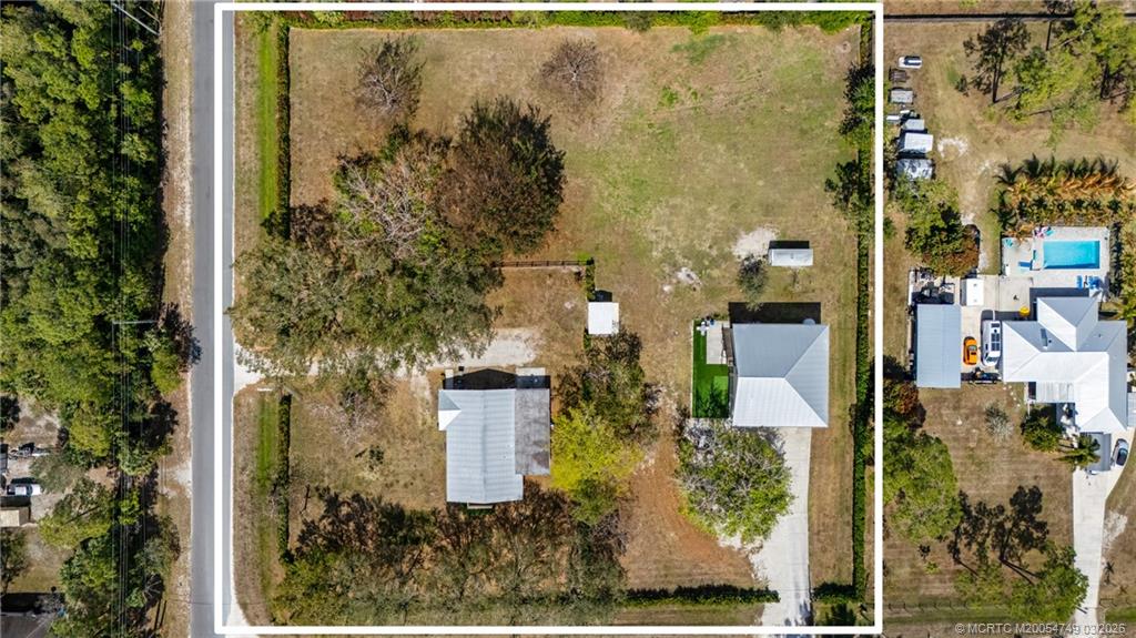 15848 129th Terrace North Jupiter, FL 33478 - Photo 16 of 52 an aerial view of a house with a yard