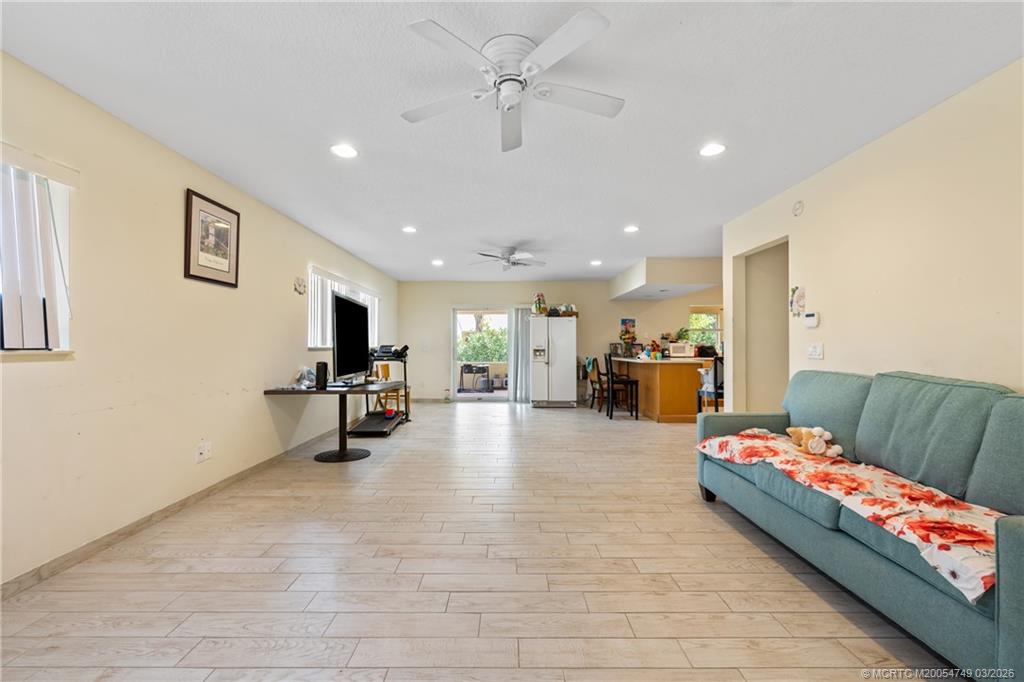 15848 129th Terrace North Jupiter, FL 33478 - Photo 17 of 52 a living room with furniture and a flat screen tv