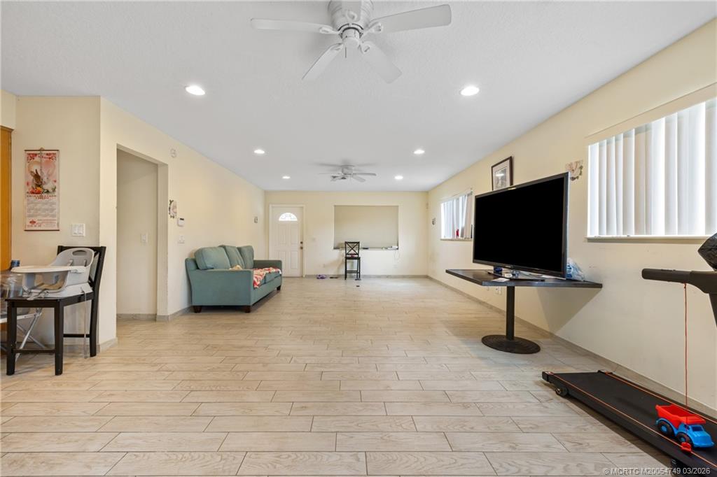15848 129th Terrace North Jupiter, FL 33478 - Photo 18 of 52 a living room with furniture and a flat screen tv