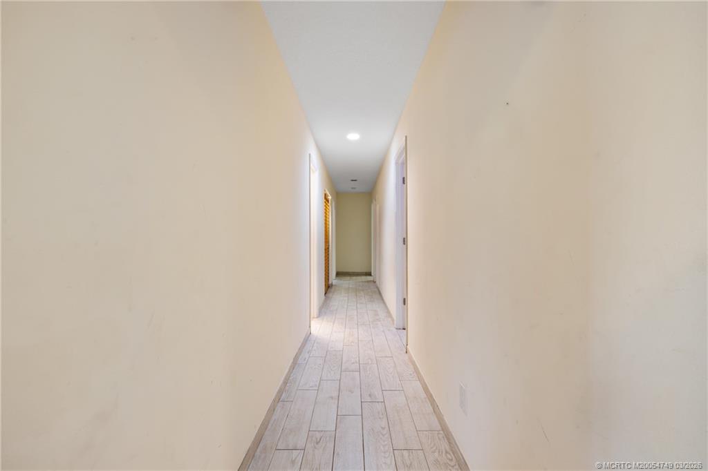 15848 129th Terrace North Jupiter, FL 33478 - Photo 21 of 52 a view of a hallway with wooden floor