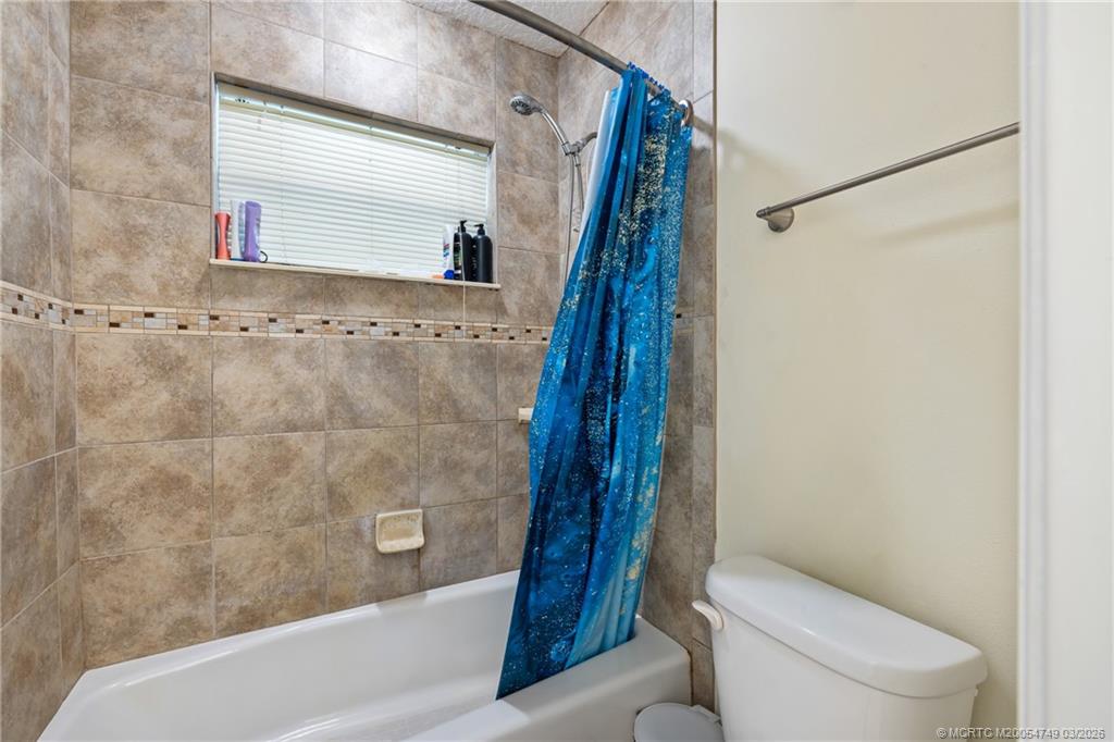 15848 129th Terrace North Jupiter, FL 33478 - Photo 26 of 52 a bathroom with a toilet and a shower