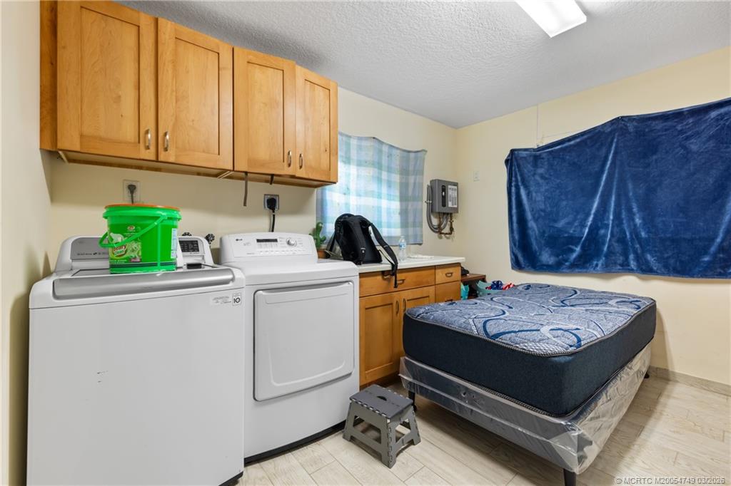 15848 129th Terrace North Jupiter, FL 33478 - Photo 31 of 52 a bed room with a bed and furniture