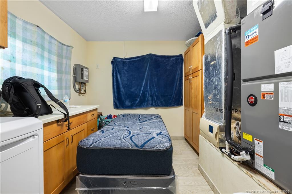 15848 129th Terrace North Jupiter, FL 33478 - Photo 32 of 52 a bedroom with a bed and a dresser