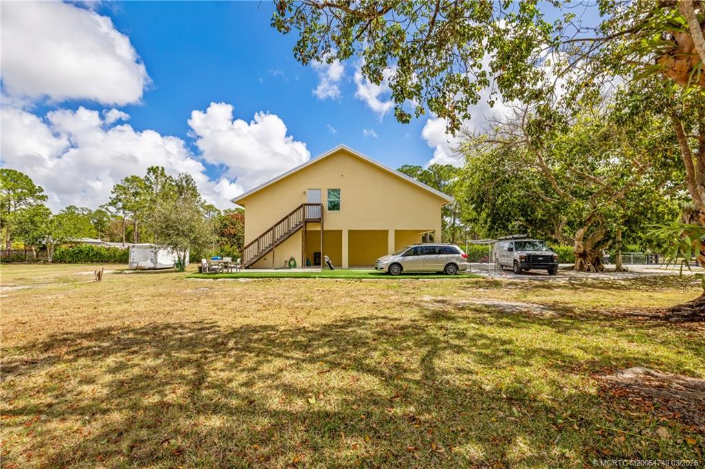15848 129th Terrace North Jupiter, FL 33478 - Photo 35 of 52 a front view of a house with garden