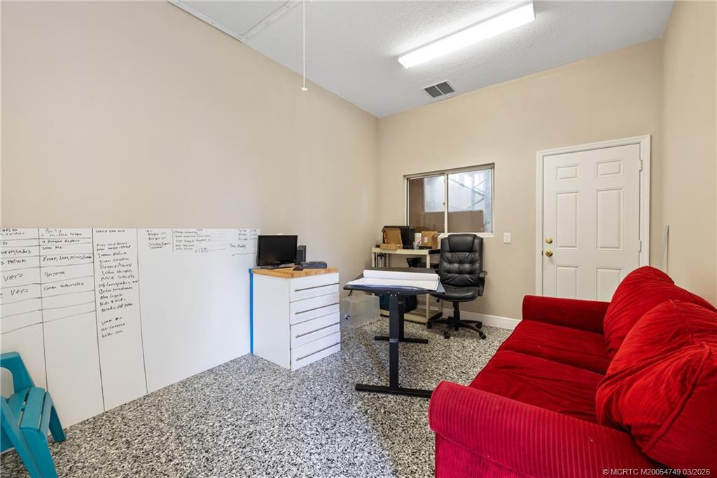 15848 129th Terrace North Jupiter, FL 33478 - Photo 40 of 52 a workspace with furniture and window