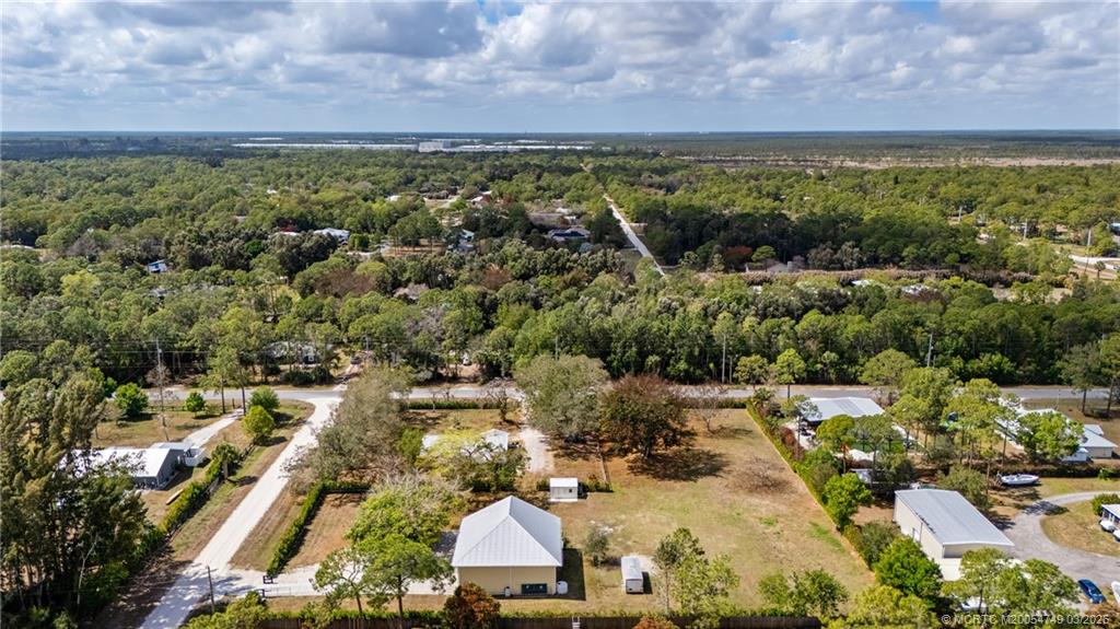 15848 129th Terrace North Jupiter, FL 33478 - Photo 48 of 52 an aerial view of residential houses with outdoor space