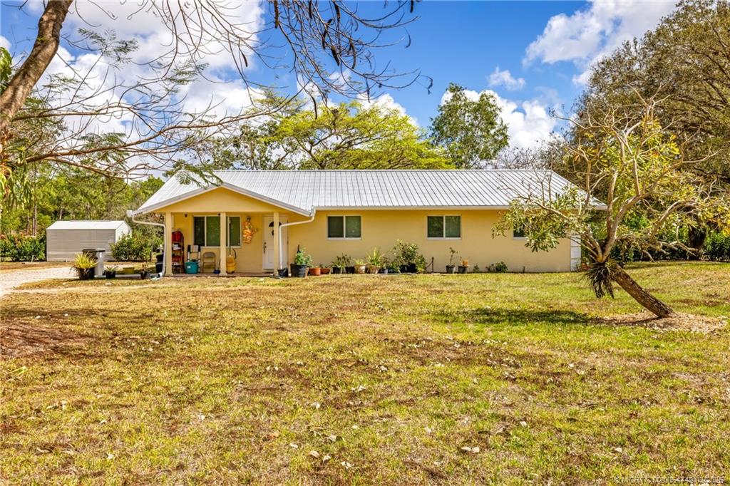 15848 129th Terrace North Jupiter, FL 33478 - Photo 5 of 52 a view of a house with a yard