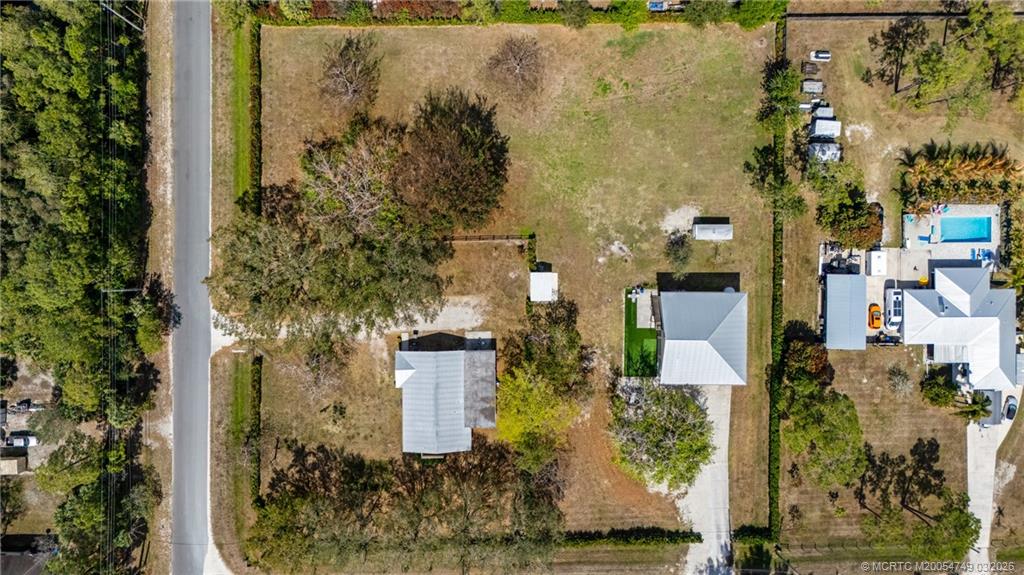 15848 129th Terrace North Jupiter, FL 33478 - Photo 51 of 52 an aerial view of a house with a yard