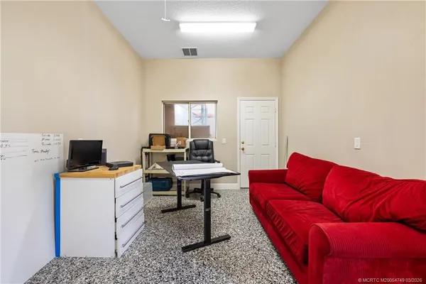 a living room with furniture and a table