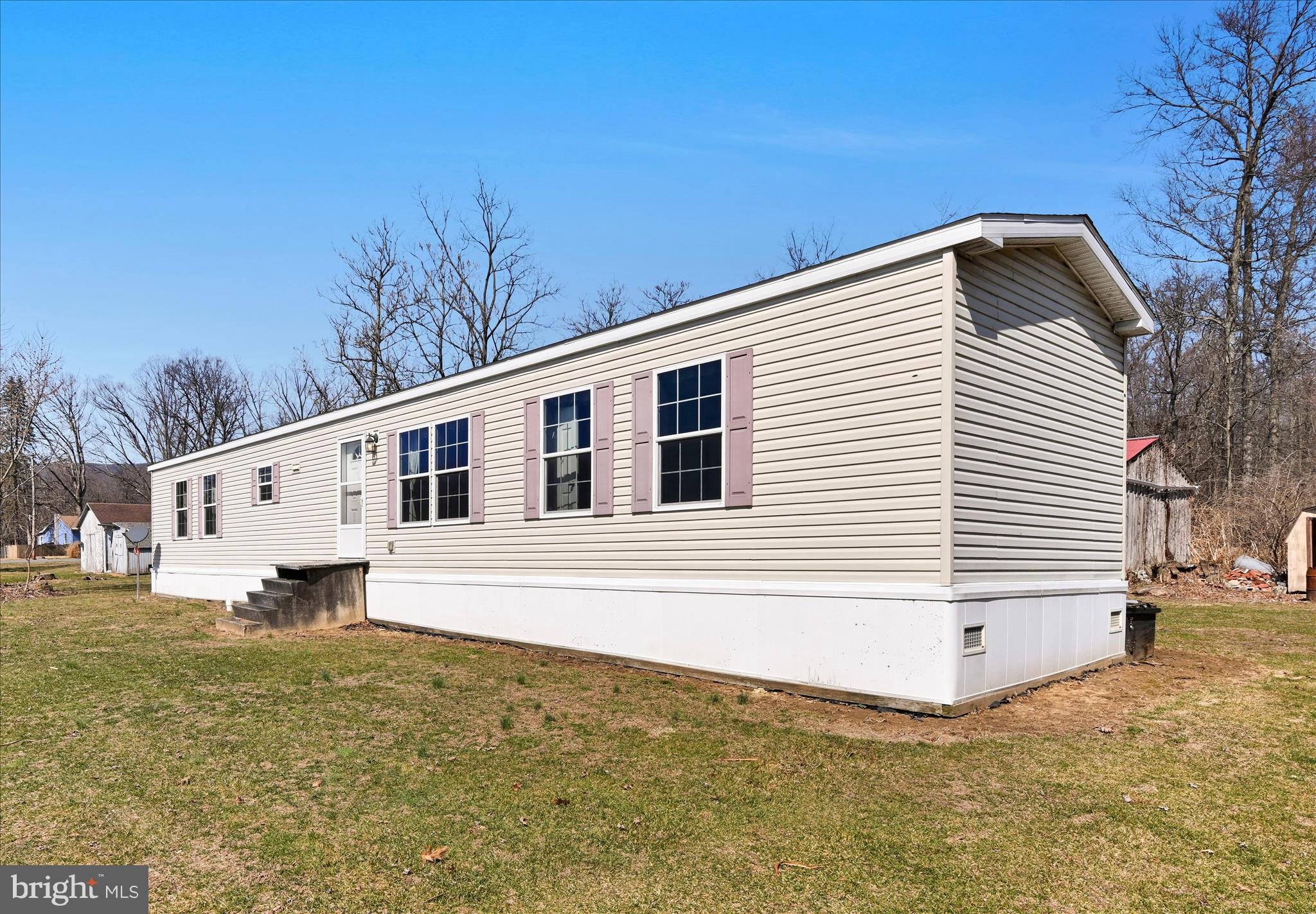 571 Schubert Road Bethel, PA 19507 - Photo 1 of 36 a front view of a house with a yard