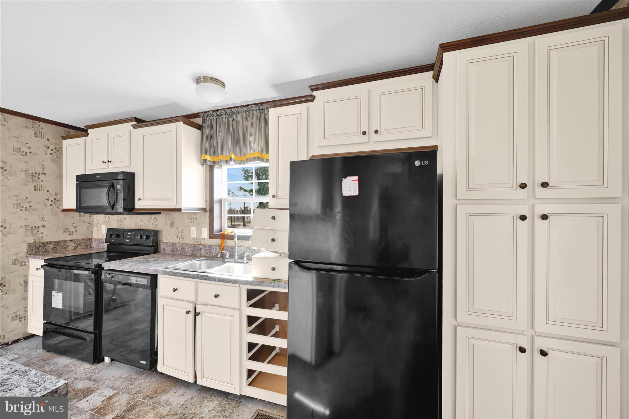 571 Schubert Road Bethel, PA 19507 - Photo 18 of 36 a kitchen with stainless steel appliances a refrigerator sink and cabinets