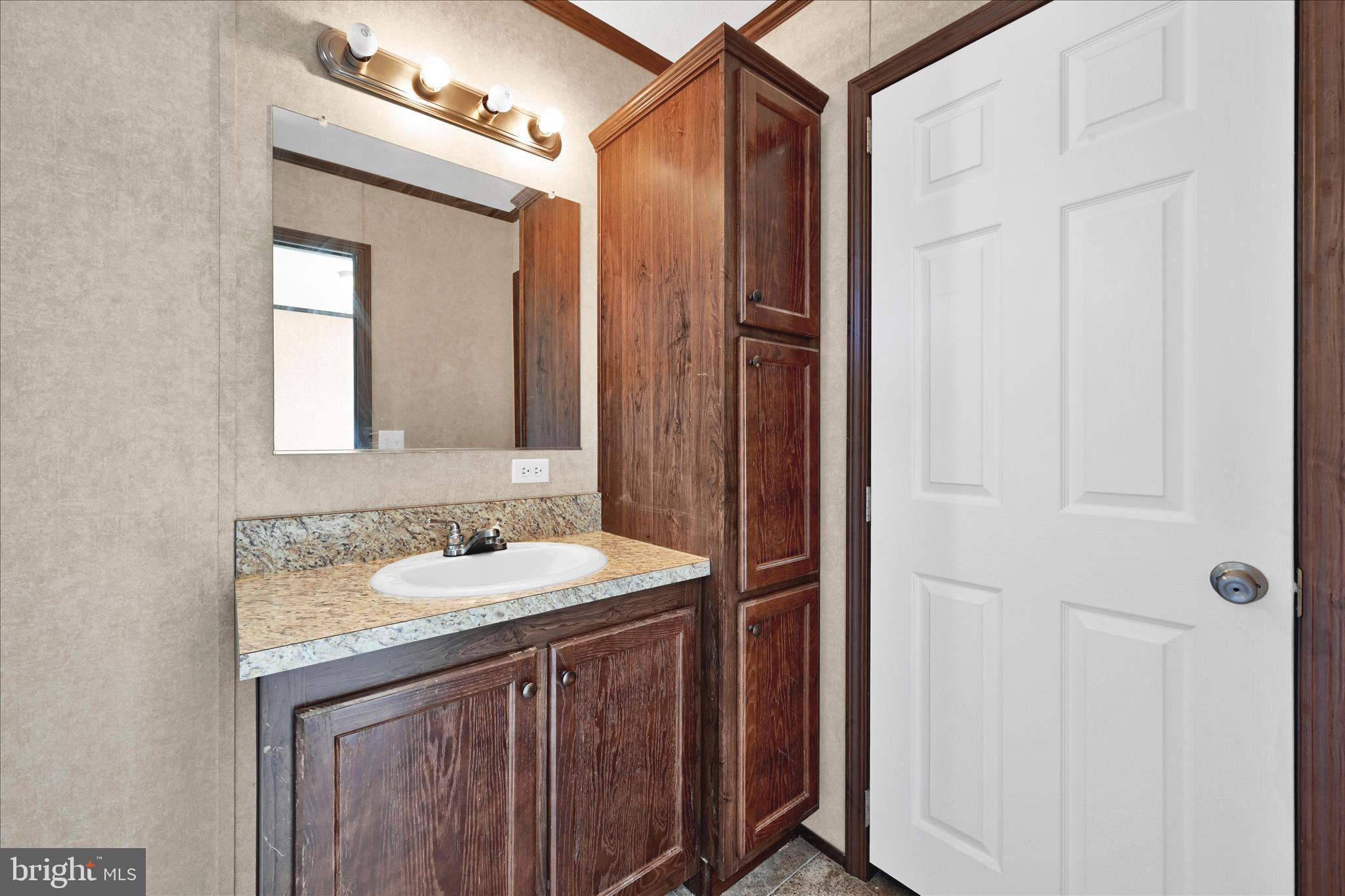 571 Schubert Road Bethel, PA 19507 - Photo 21 of 36 a bathroom with a sink and a mirror