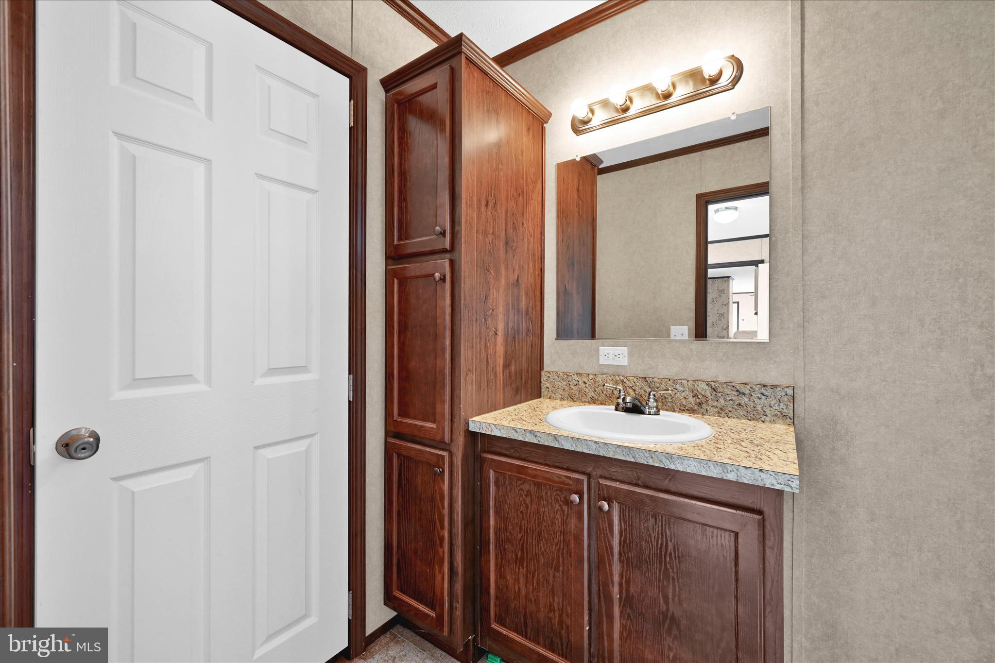 571 Schubert Road Bethel, PA 19507 - Photo 24 of 36 a bathroom with a sink and a mirror