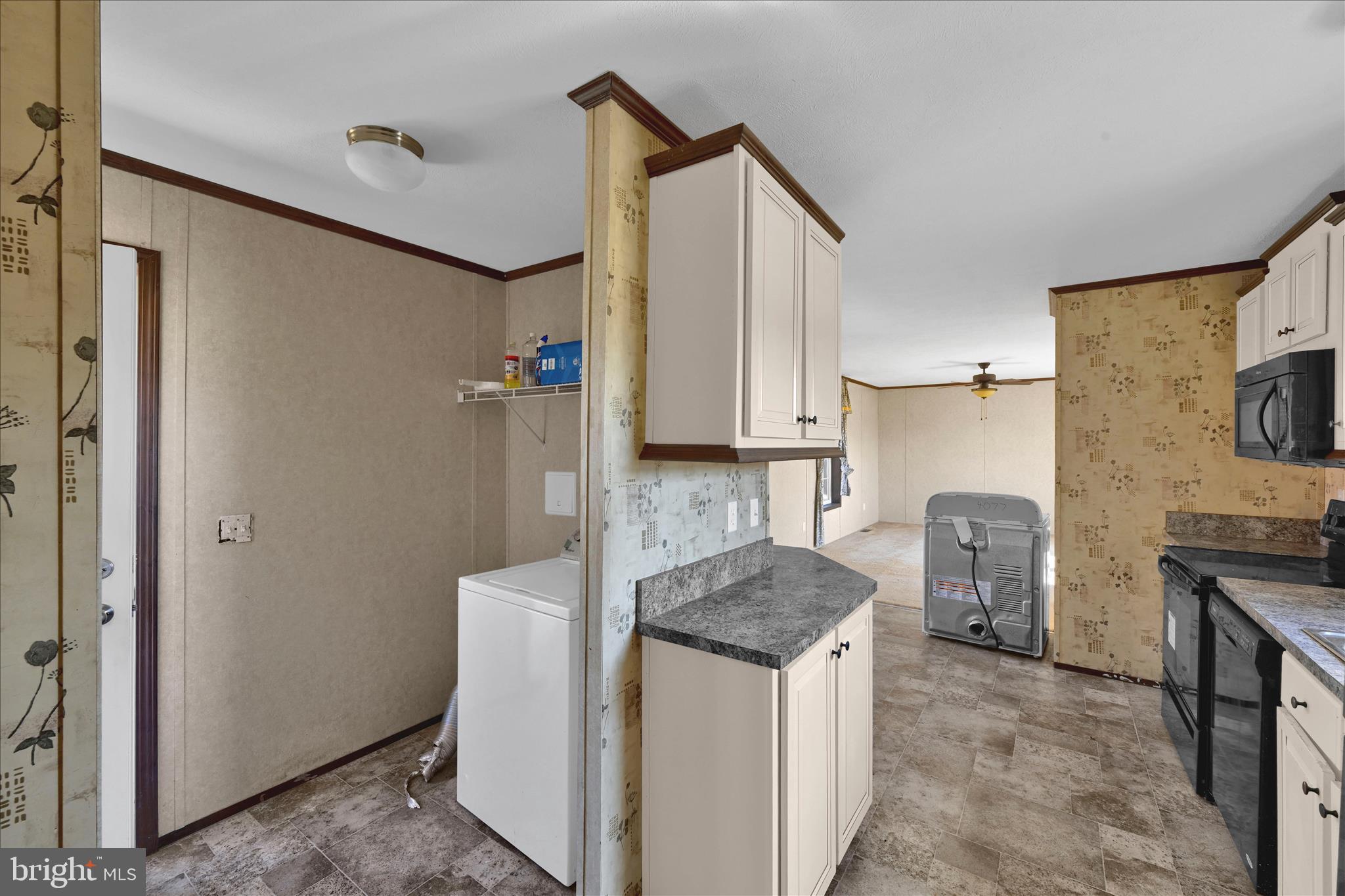 571 Schubert Road Bethel, PA 19507 - Photo 25 of 36 a kitchen with granite countertop a sink a counter space and stainless steel appliances