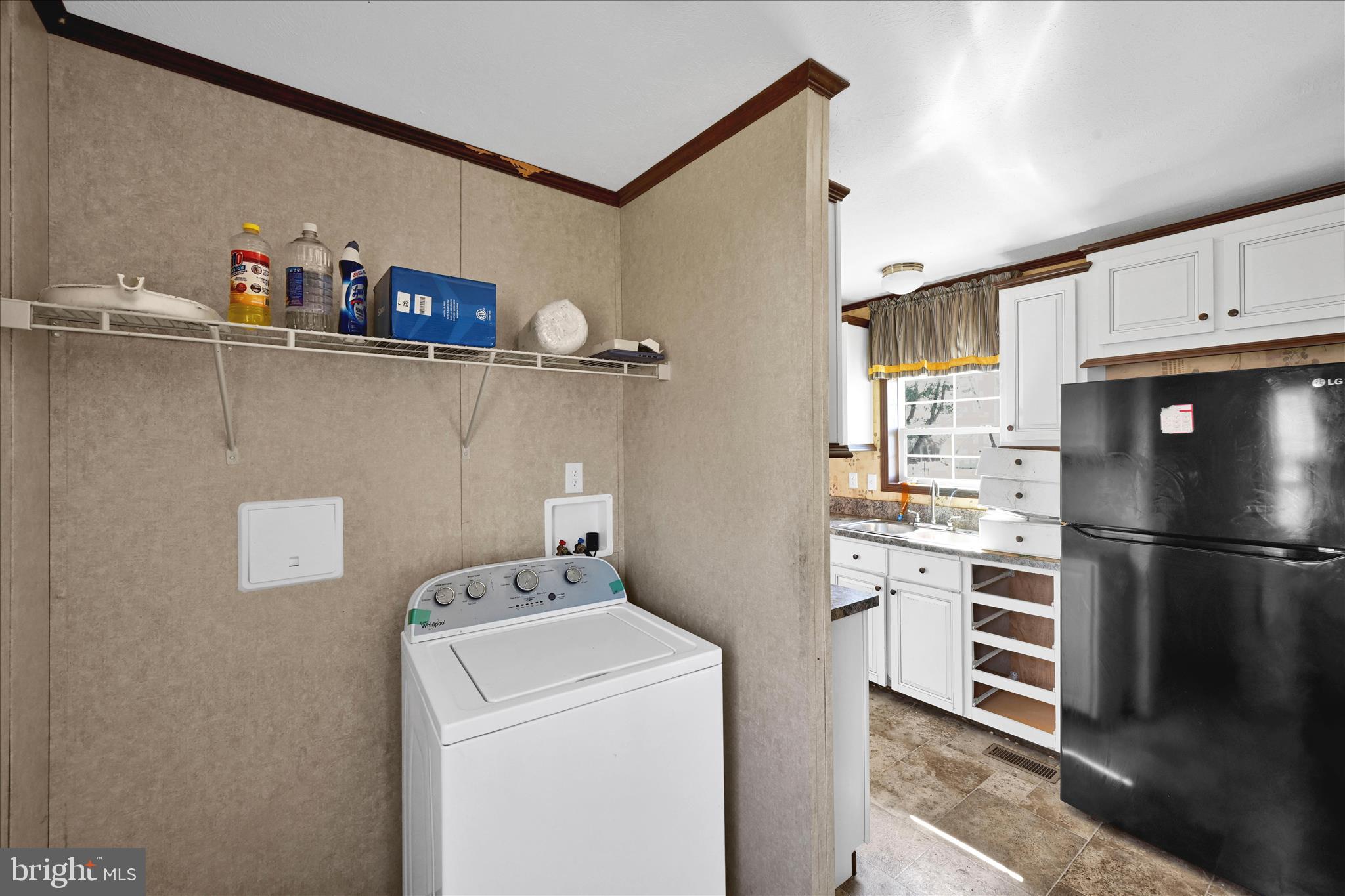 571 Schubert Road Bethel, PA 19507 - Photo 26 of 36 a kitchen with a refrigerator and white cabinets