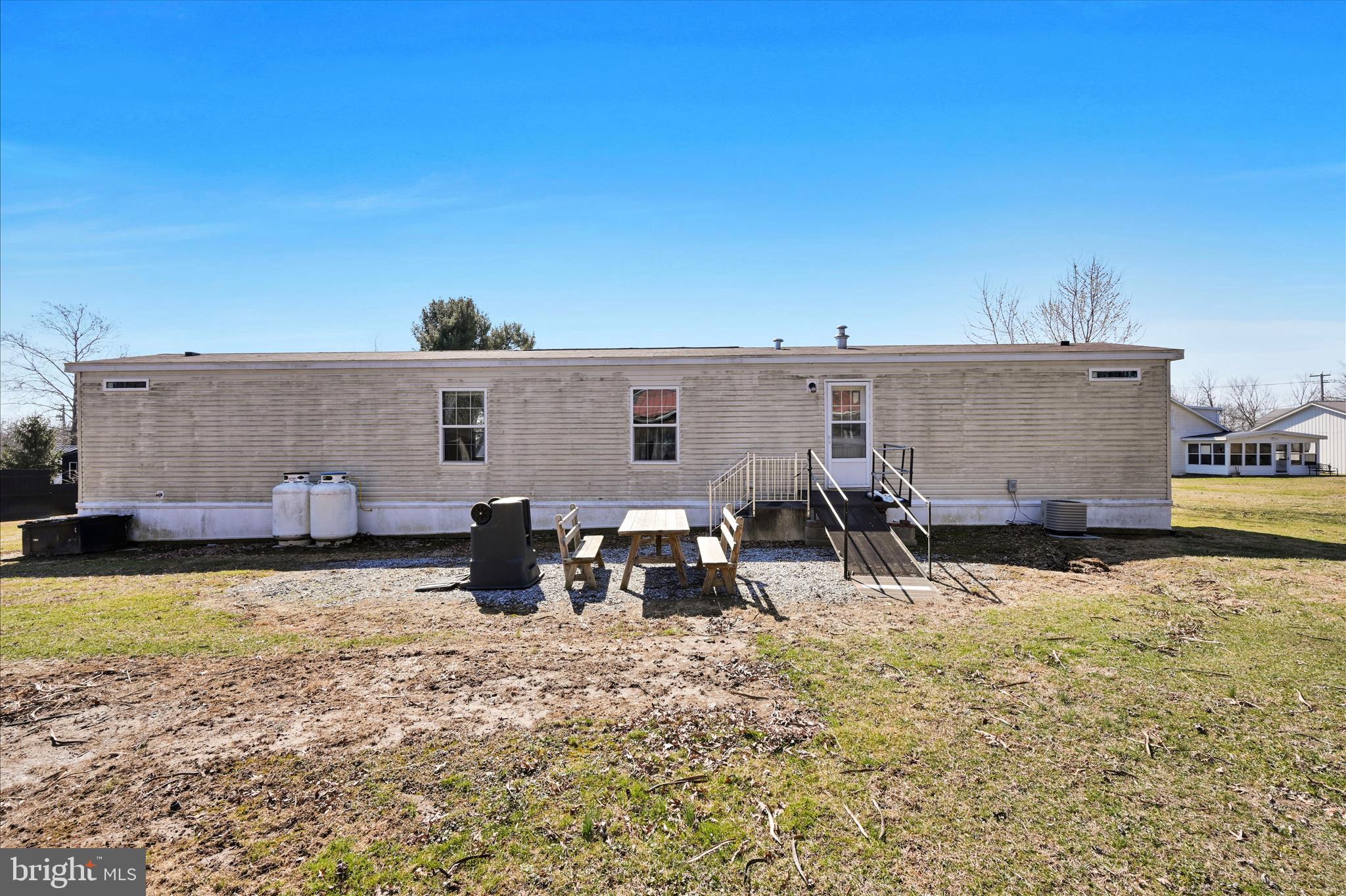 571 Schubert Road Bethel, PA 19507 - Photo 32 of 36 a view of a backyard with table and chairs