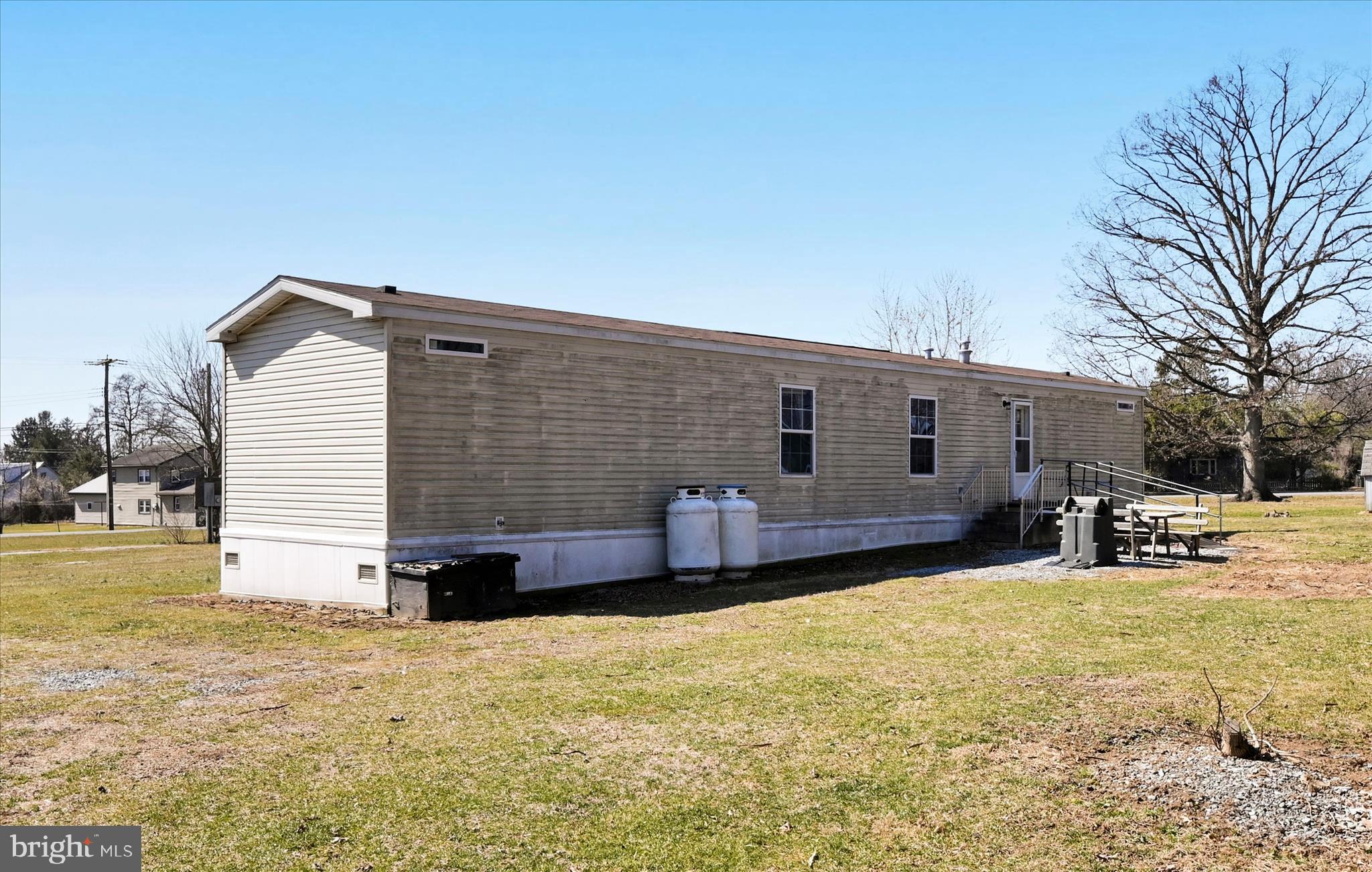 571 Schubert Road Bethel, PA 19507 - Photo 33 of 36 a front view of house with yard and seating area