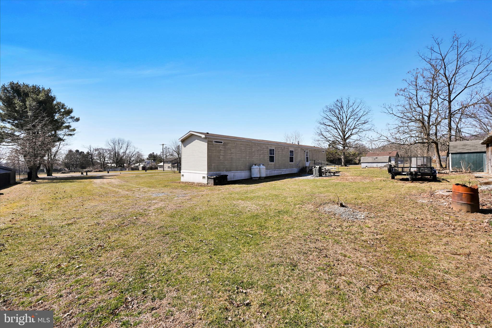 571 Schubert Road Bethel, PA 19507 - Photo 34 of 36 a street view with large trees