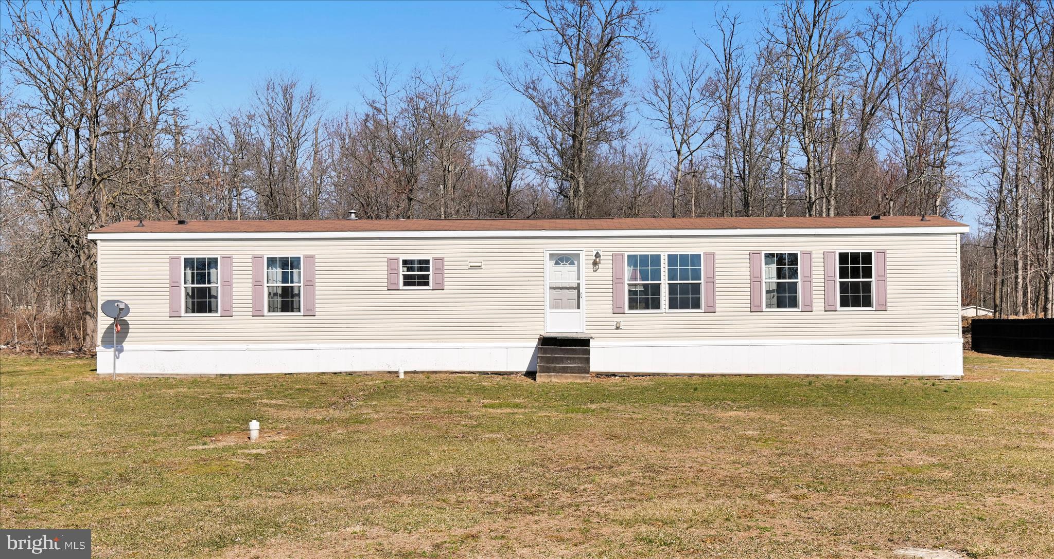 571 Schubert Road Bethel, PA 19507 - Photo 5 of 36 a front view of a house with a garden