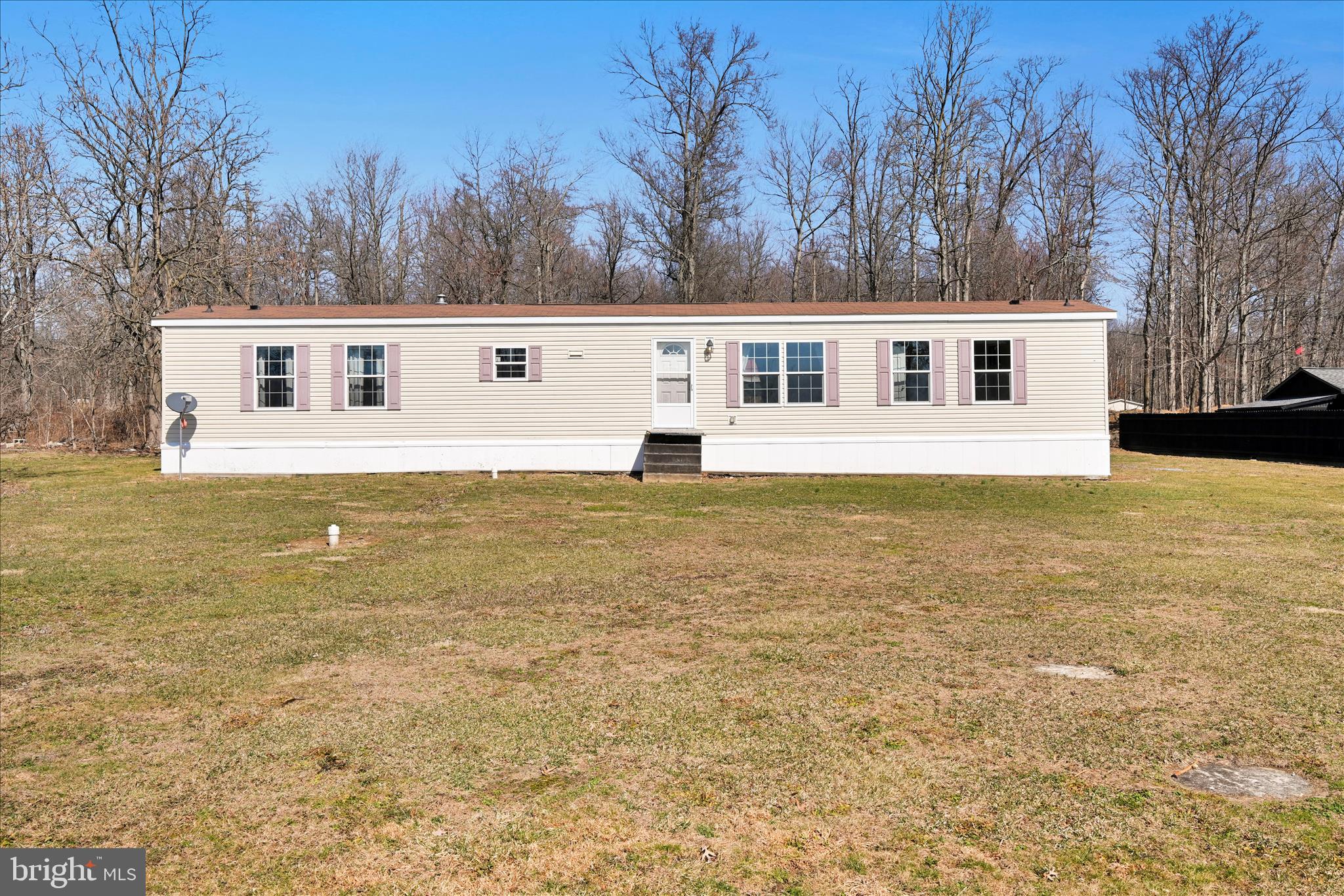 571 Schubert Road Bethel, PA 19507 - Photo 6 of 36 a front view of a house with a yard
