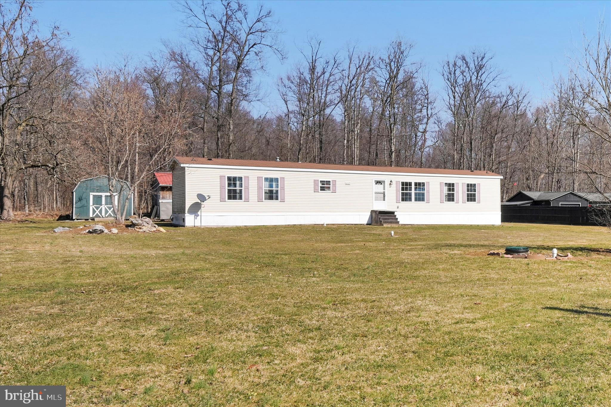 571 Schubert Road Bethel, PA 19507 - Photo 8 of 36 a view of a swimming pool with trees