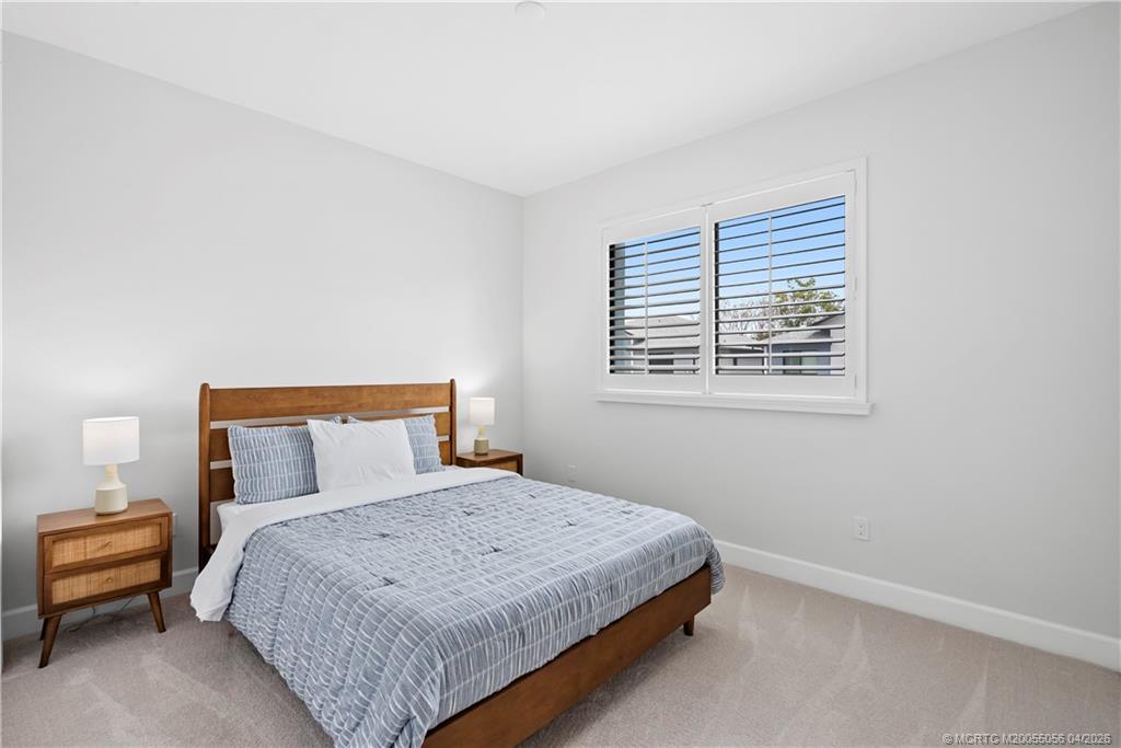 3660 Magnolia Rdg Lane Palm City, FL 34990 - Photo 11 of 35 a bedroom with a bed and a window