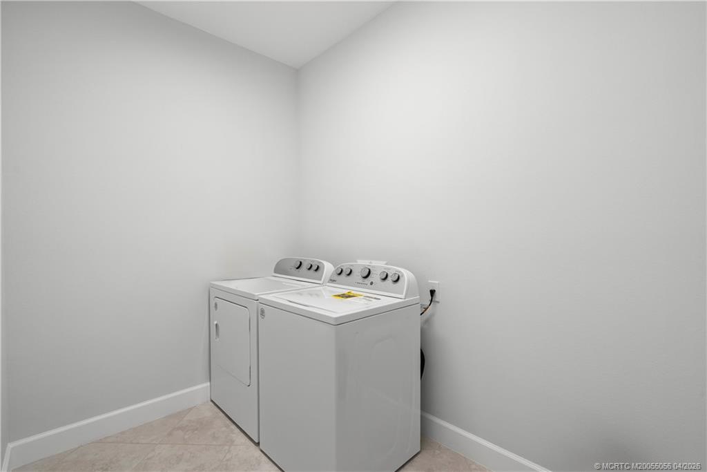 3660 Magnolia Rdg Lane Palm City, FL 34990 - Photo 23 of 35 a utility room with dryer and washer