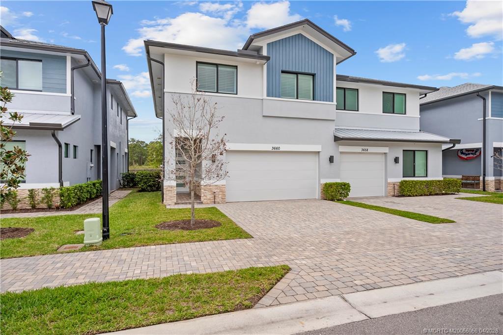 3660 Magnolia Rdg Lane Palm City, FL 34990 - Photo 33 of 35 a front view of house with yard and green space