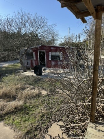 3035 County Road 255 Georgetown, TX 78633 - Photo 14 of 23 a view of a barn in the middle of a yard