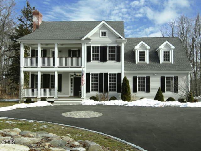 283 June Road Stamford, CT 06903 - Photo 1 of 1 a front view of a house with a yard