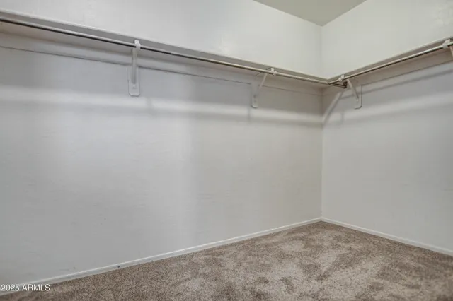 a view of an empty walk in closet