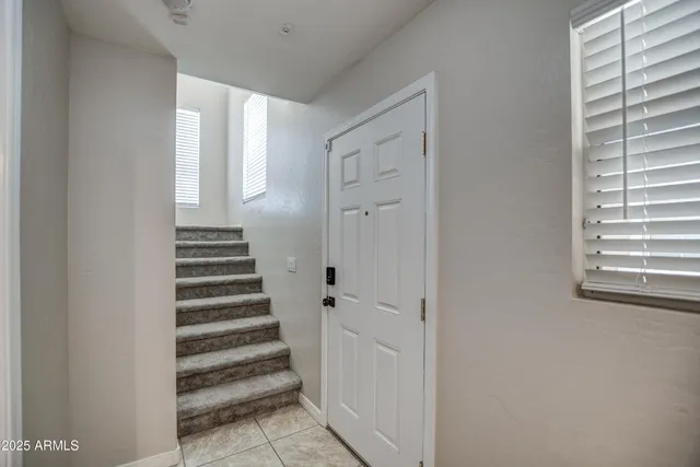a view of a hallway with stairs